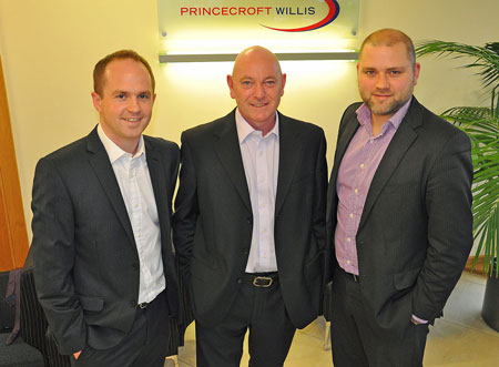 Mark Johns, Princecroft Willis' managing director (centre) congratulates former trainees Dan Tout (left) and Sam Chapman (right) on their promotions