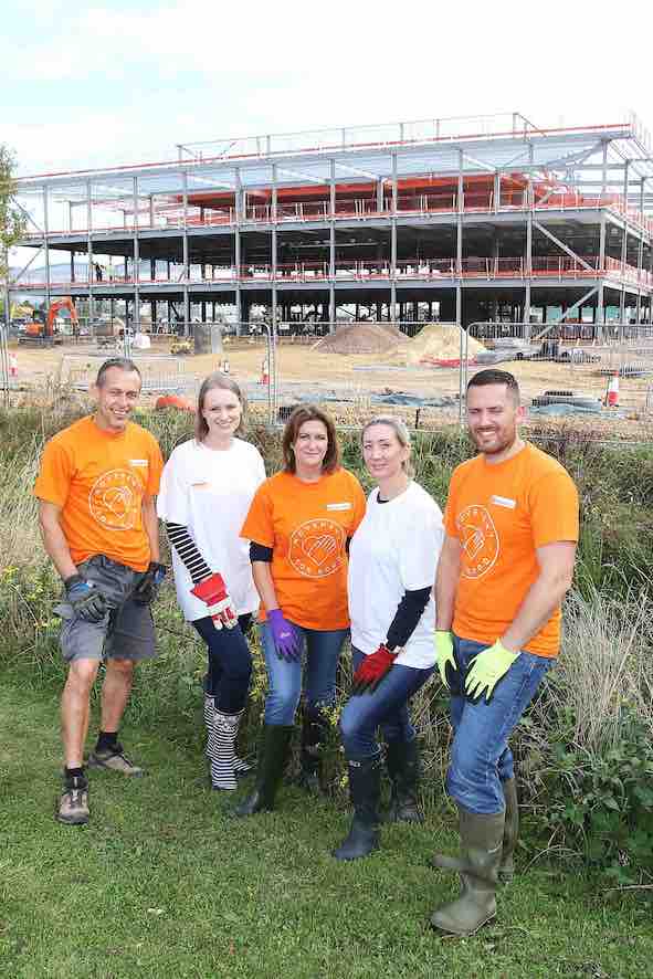 The Business Magazine article image for: Volunteers from Gloucester insurer spruce up new office site