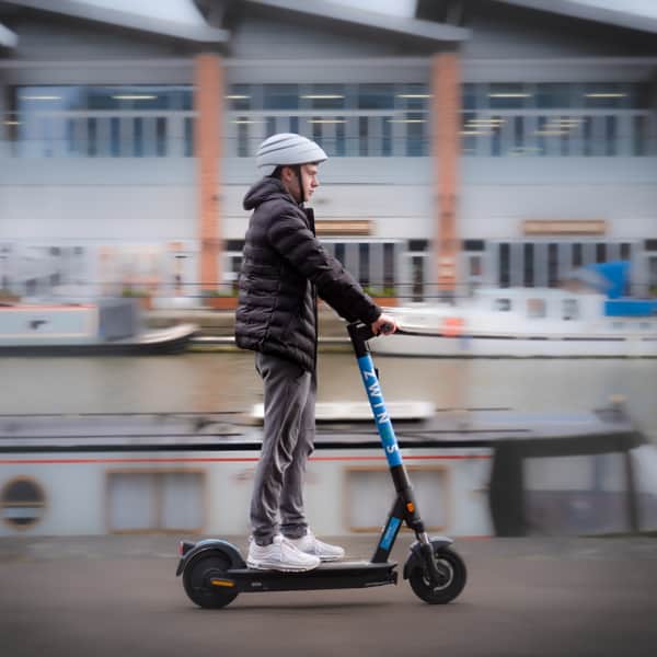 A Zwings rental e-scooter in action