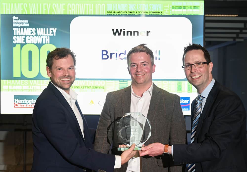 Alistair McArthur, Herrington Carmichael (right) presents Workforce of the Year to Antony Young and Scott Nicholson from Bridewell