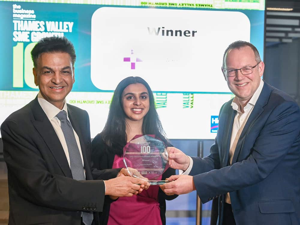 Stuart Weekes, Crowe (right) presents SME Growth 100 Award (above £10m) to Dr Bippon Vinayak and Monisha Vinayak from Square Health