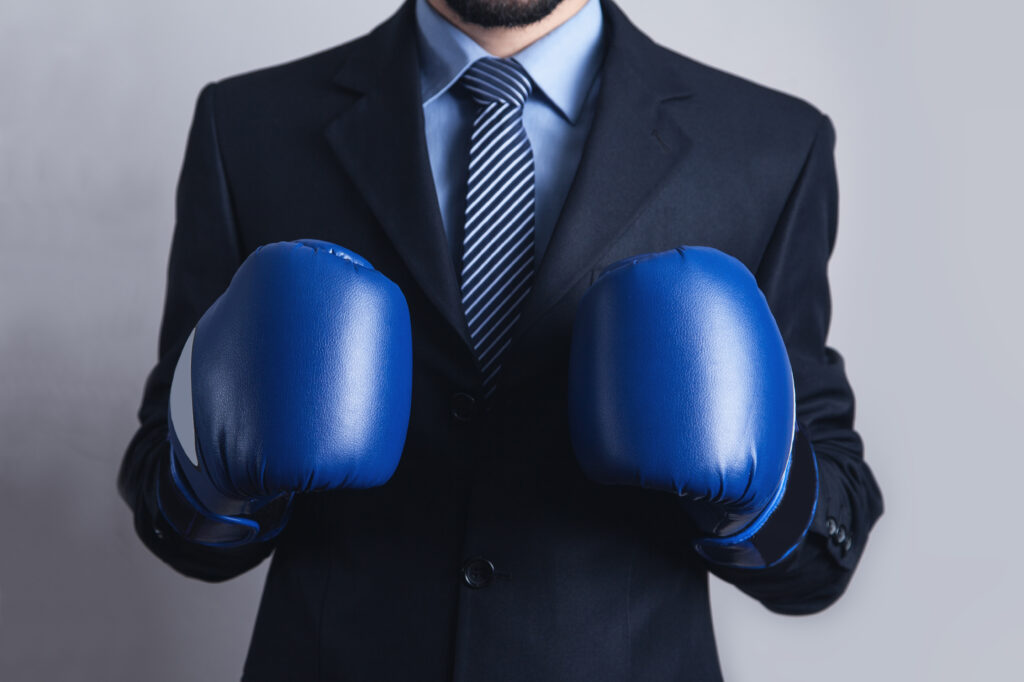 Businessman in boxing gloves.