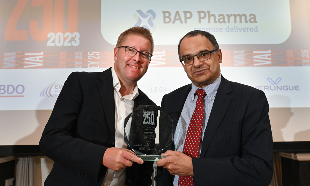 Bashir Parkar, CEO at BAP Pharma receiving CEO of the Year (over £50m) trophy from Richard Bevins, Director of Corporate & Risk Management at sponsor Verlingue