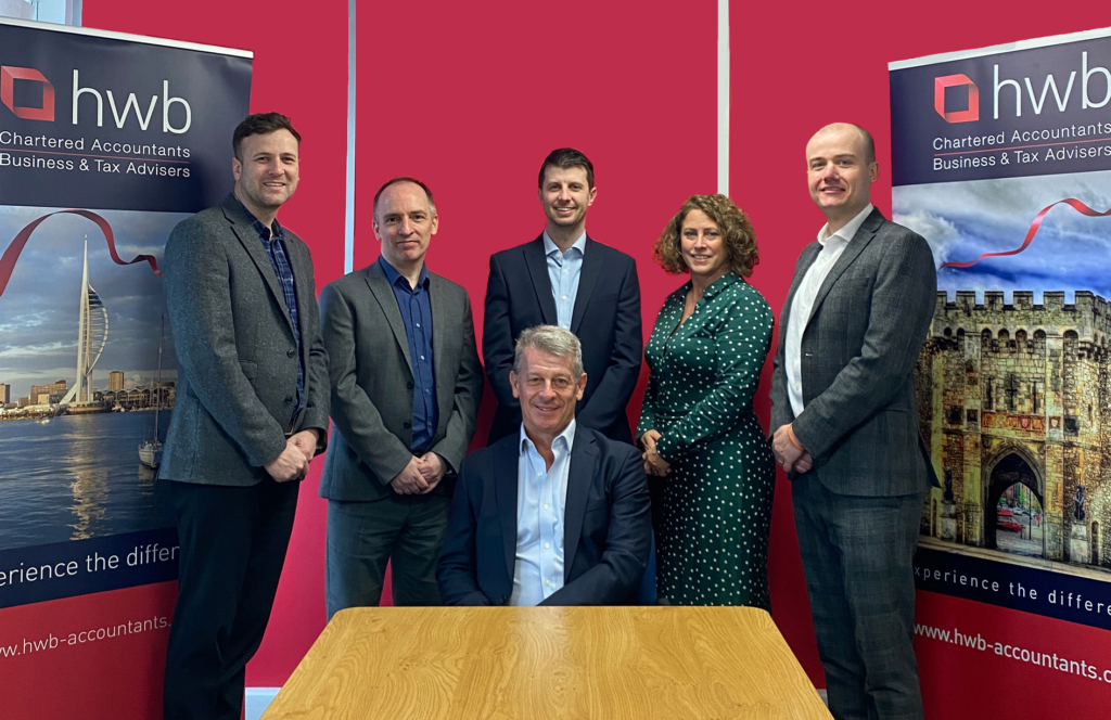 HWB's registered auditors. From left: Directors James Flood and Gary Brown, associate director Tom Young, director Michaela Johns and associate director Matt Cooper. Seated is director Alan Williams. Picture contributed.
